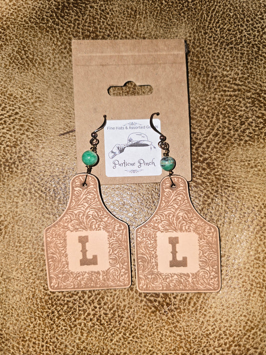Burned Leather Cow Tag Earrings with Initial “L” and Turquoise Bead Accent