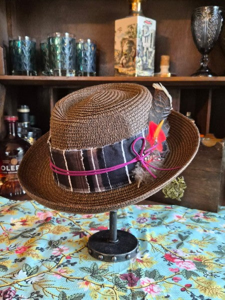 Brown straw boater hat size M with plaid ribbon hatband and mixed feather accent